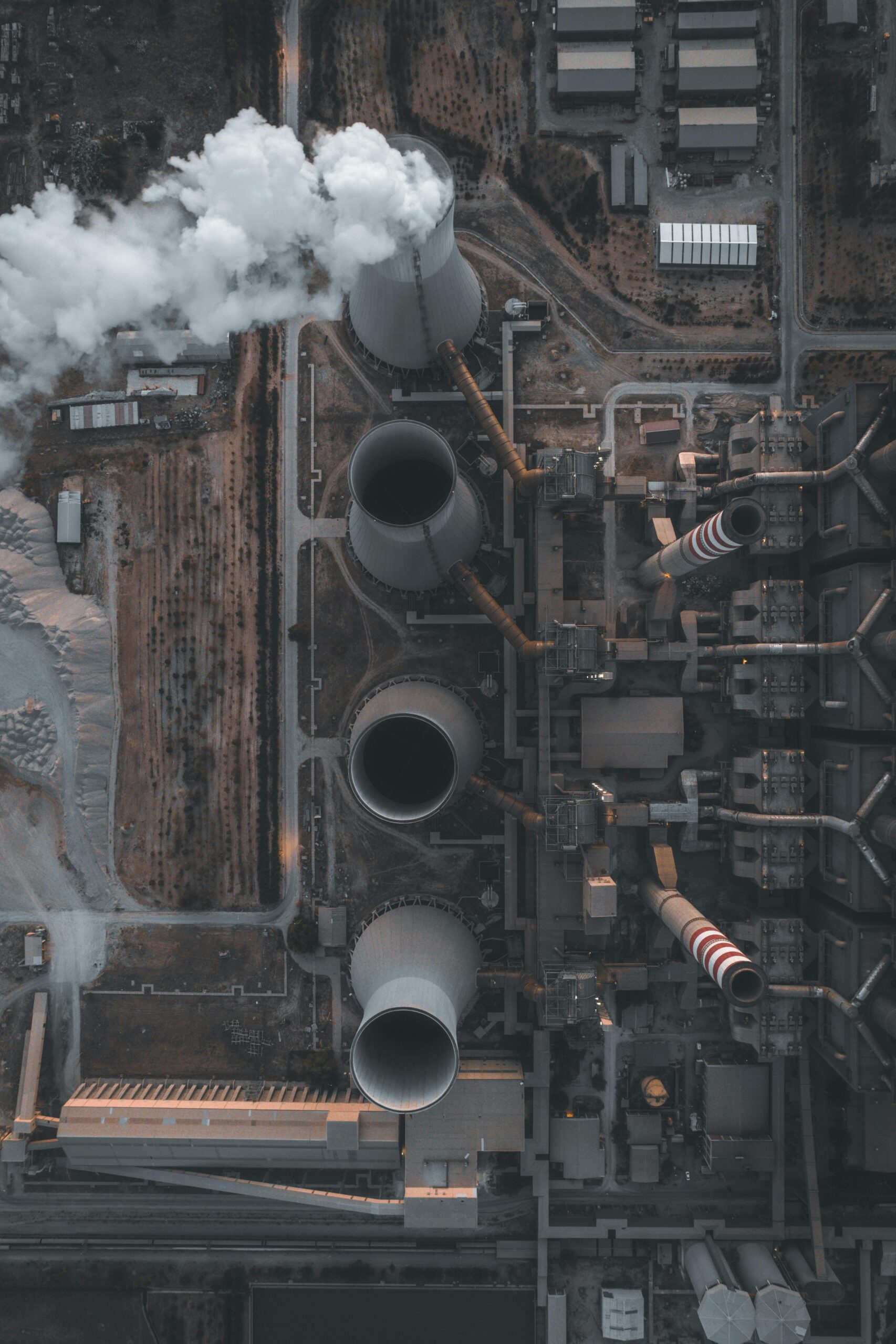 Aerial view capturing the intricate details of a power plant in Turkey, showing smoke emissions and infrastructure.